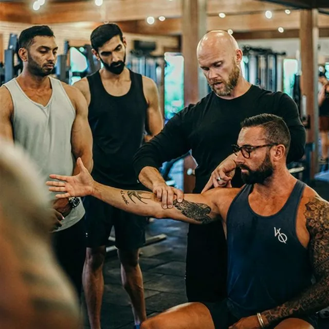 Ben correcting arm form with a client one-on-one
