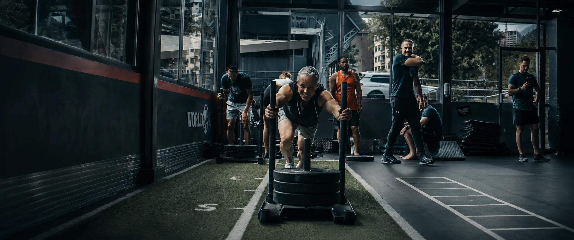 Coaches working the gym floor during a Muscle Camp training block