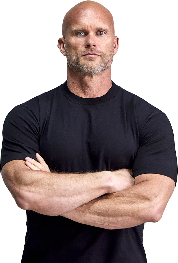 Ben Pakulski, founder of Muscle Intelligence, standing with arms crossed.